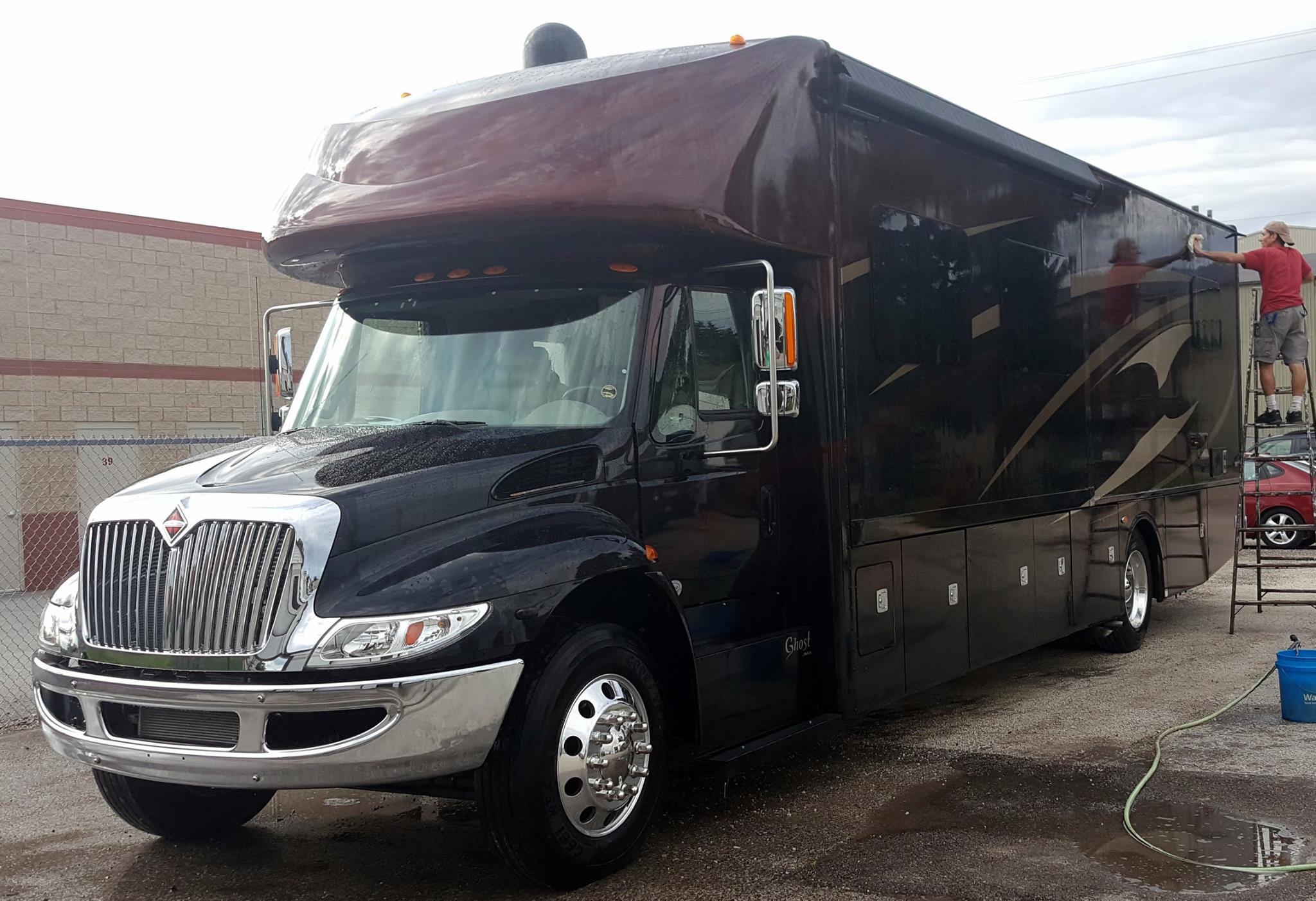 Large motorhome being detailed &mdash; Engine clean and specialty services