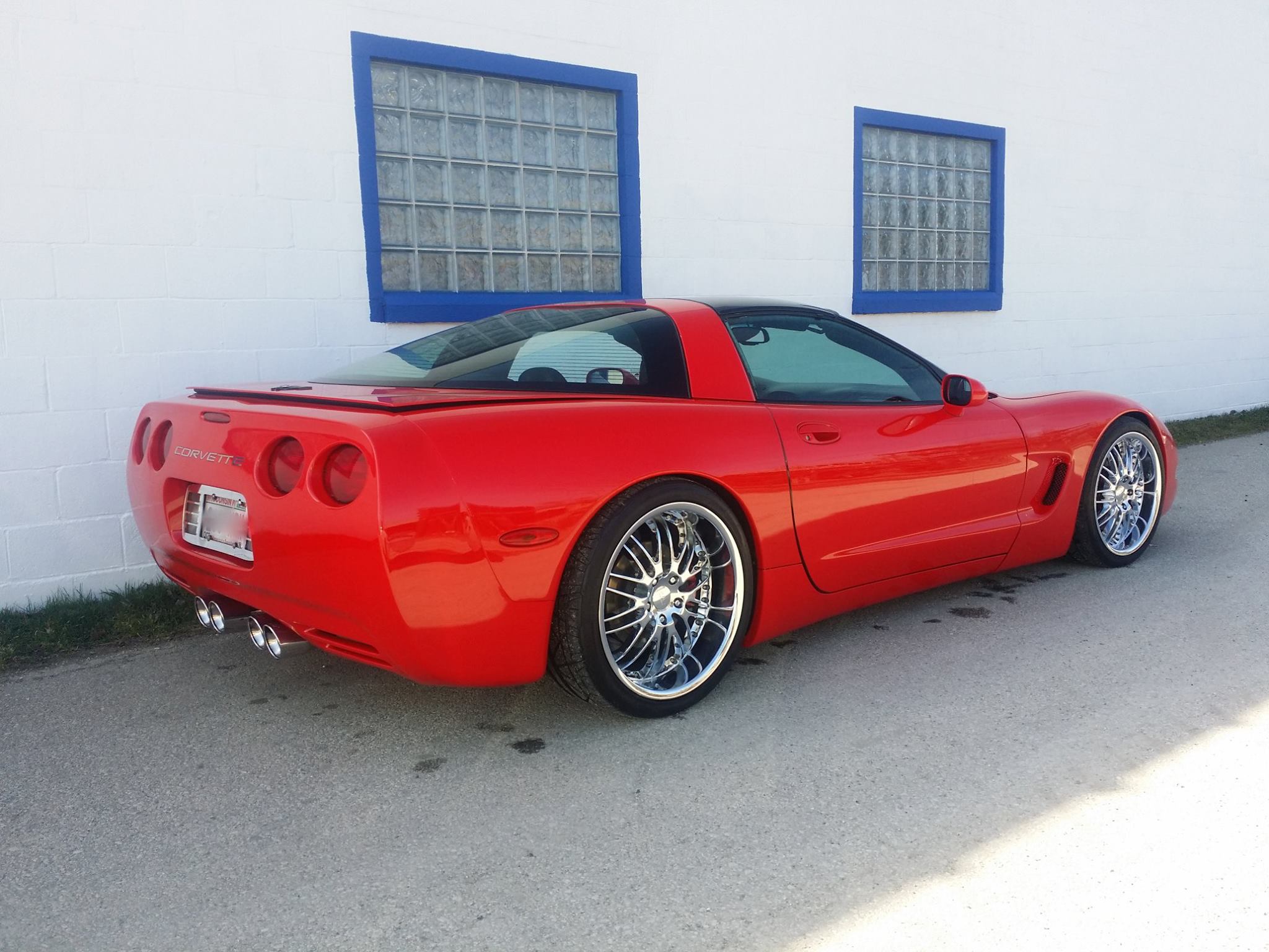 Gleaming red Corvette &mdash; Hand Wash and Wax service